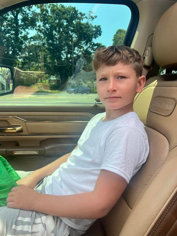 Hudson smiling in the passenger seat