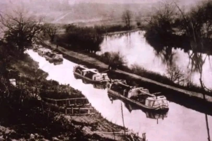 Historic photograph of boats along the canal