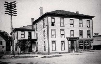 Historic photograph of Hotel Navarre, the original building on this lot